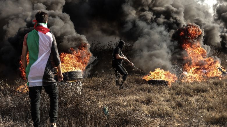 Palestinians set tires on fire during a demonstration against what they say are Israeli "violations" in Jerusalem at the Al Aqsa Mosque, in Gaza Strip on September 22, 2023. 