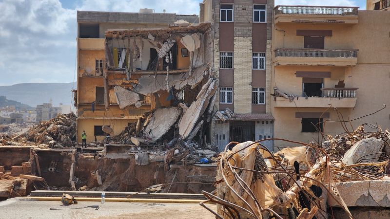 NextImg:Clinging to hope in Derna, as grief turns to anger | CNN