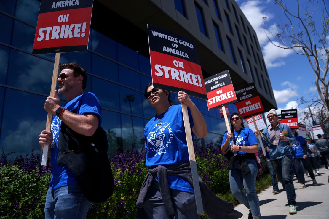Striking Writers Guild of America workers picket outside the Sunset Bronson Studios building on May 2, 2023 in Los Angeles, California. After talks with studios and streamers over pay and working conditions failed to result in a deal, more than 11,000 Hollywood television and movie writers went on their first strike in 15 years. Late-night shows are expected to stop production immediately, while television series and movies scheduled for release later this year and beyond could face major delays.