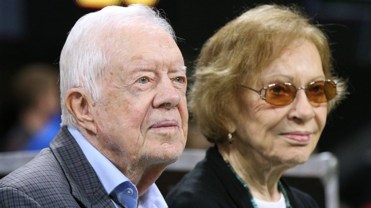 Former President Jimmy Carter and first lady Rosalynn Carter attend an NFL game between the Atlanta Falcons and Cincinnati Bengals on September 30, 2018.