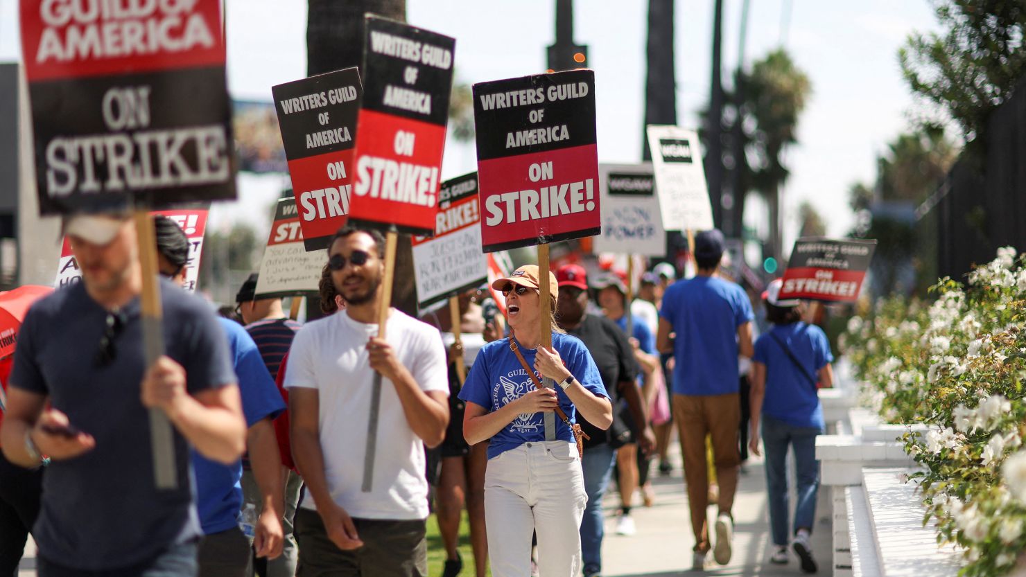 SAG-AFTRA actors and Writers Guild of America writers walk the picket line during their strike outside Netflix offices in Los Angeles earlier this month.