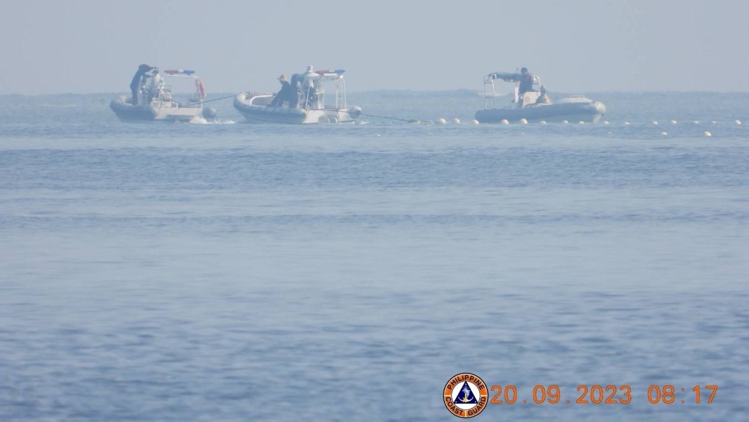 Chinese Coast Guard boats close to the floating barrier are pictured on September 20, 2023, near the Scarborough Shoal in the South China Sea, in this handout image released by the Philippine Coast Guard on September 24, 2023. Philippine Coast Guard/Handout via REUTERS THIS IMAGE HAS BEEN SUPPLIED BY A THIRD PARTY. MANDATORY CREDIT. NO RESALES. NO ARCHIVES