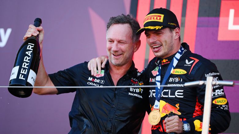 SUZUKA, JAPAN - SEPTEMBER 24: Race winner Max Verstappen of the Netherlands and Oracle Red Bull Racing and Red Bull Racing Team Principal Christian Horner celebrate on the podium during the F1 Grand Prix of Japan at Suzuka International Racing Course on September 24, 2023 in Suzuka, Japan. (Photo by Clive Mason/Getty Images)