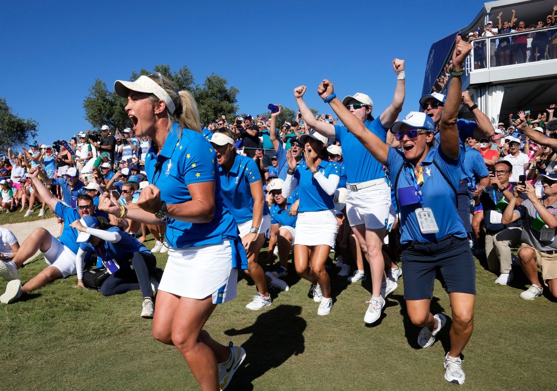 Members of the Europe team and supporters celebrate at the end of the match between Europe's Carlota Ciganda and United States' Nelly Korda at the Solheim Cup golf tournament in Finca Cortesin, near Casares, southern Spain, Sunday, Sept. 24, 2023. Europe play the United States in this biannual women's golf tournament, which played alternately in Europe and the United States.