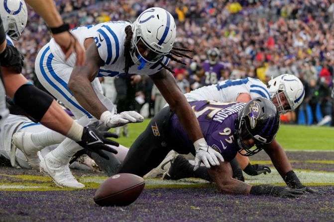 Indianapolis Colts tight end Mo Alie-Cox and Baltimore Ravens linebacker Tavius Robinson go after a fumble in the end zone on September 24. The Colts beat the Ravens 22-19.
