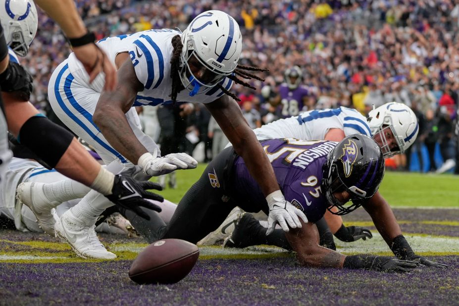 Indianapolis Colts tight end Mo Alie-Cox and Baltimore Ravens linebacker Tavius Robinson go after a fumble in the endzone. The Colts beat the Ravens 22-19.