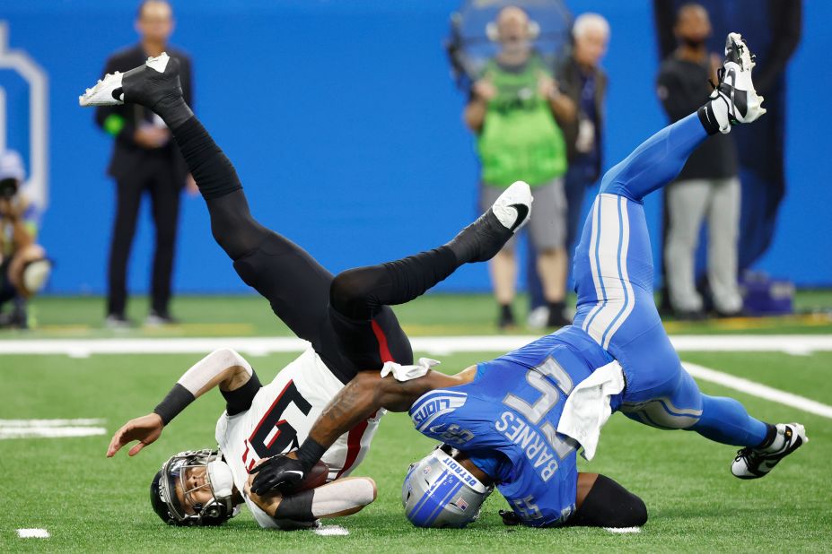 Atlanta Falcons quarterback Desmond Ridder is sacked by Detroit Lions linebacker Derrick Barnes in the first half at Ford Field in Detroit. The Falcons lost 20-6.