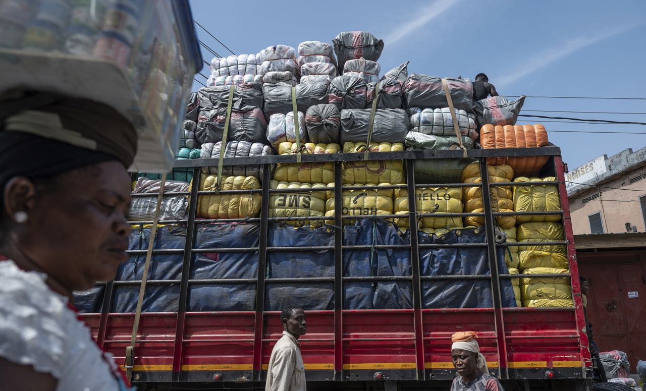 A truck containing a delivery of bales of second-hand garments at the Kantamanto textile market in Accra, Ghana, on Thursday, Sept. 15, 2022. The rise of fast fashionand shoppers preference for quantity over qualityhas led to a glut of low-value clothing that inordinately burdens developing countries. Photographer: Andrew Caballero-Reynolds/Bloomberg via Getty Images