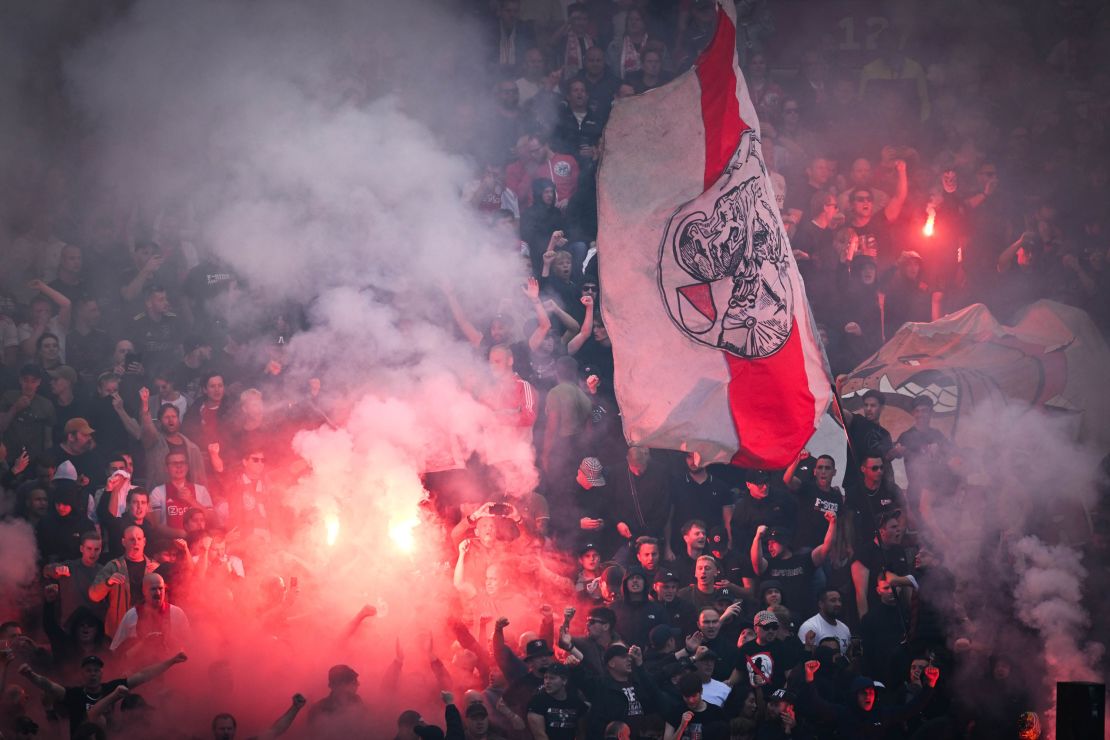 AMSTERDAM - Ajax supporters set off fireworks during the Dutch Eredivisie match between Ajax and Feyenoord at the Johan Cruijff ArenA on September 24, 2023 in Amsterdam, Netherlands. ANP OLAF KRAAK (Photo by ANP via Getty Images)