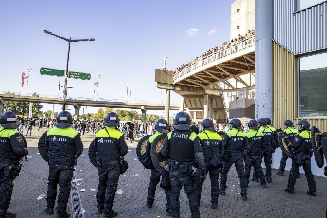 Police officers stand guard outside the Johan Cruijff Arena after the Dutch Eredivisie football match between Ajax Amsterdam and Feyenoord was suspended after fans threw flares onto the pitch, in Amsterdam on September 24, 2023. (Photo by Olaf Kraak / ANP / AFP) / Netherlands OUT (Photo by OLAF KRAAK/ANP/AFP via Getty Images)