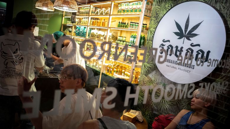 Tourists shop cannabis at the RG420 cannabis store, at Khaosan Road, one of the favourite tourist spots in Bangkok, Thailand, July 31, 2022. REUTERS/Athit Perawongmetha