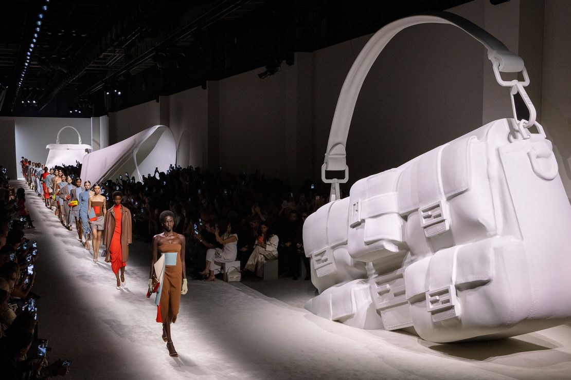 Fendi's catwalk featured large-scale sculptures of their bags as part of the set design.