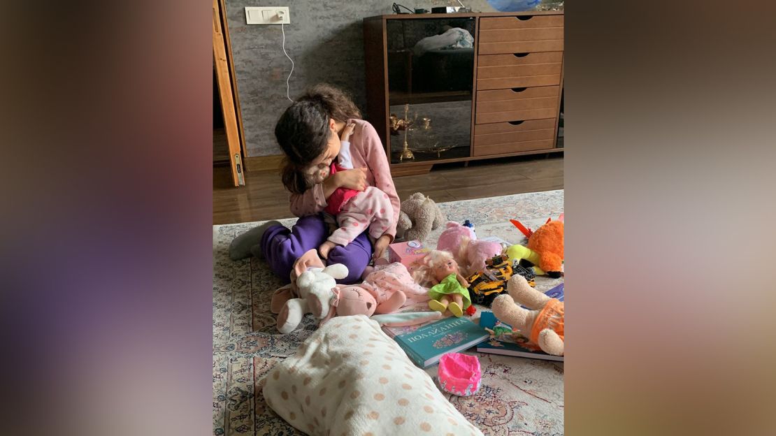 Poghosyan's daughter, aged 9, says goodbye to some of her toys.