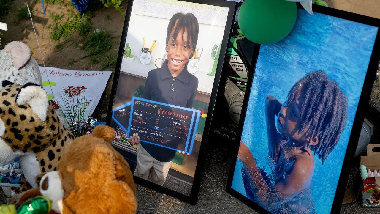 Photos of Sir'Antonio and stuffed animals help form a memorial to him on May 10, a week after he was killed.
