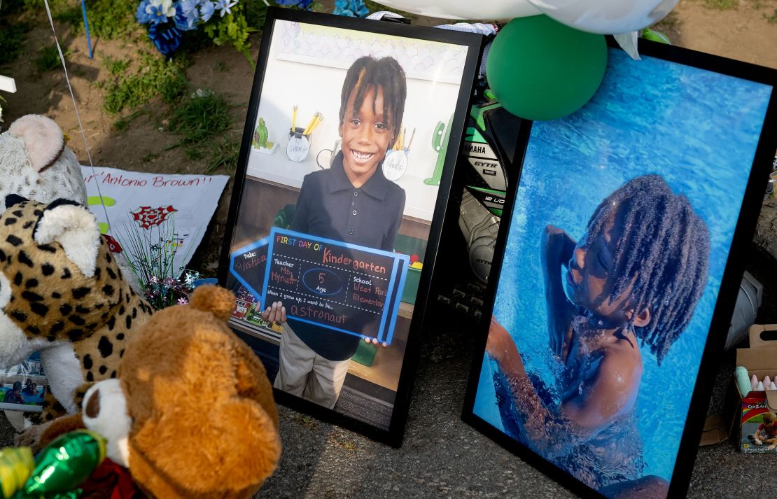 Photos of Sir'Antonio and stuffed animals help form a memorial to him on May 10, a week after he was killed.