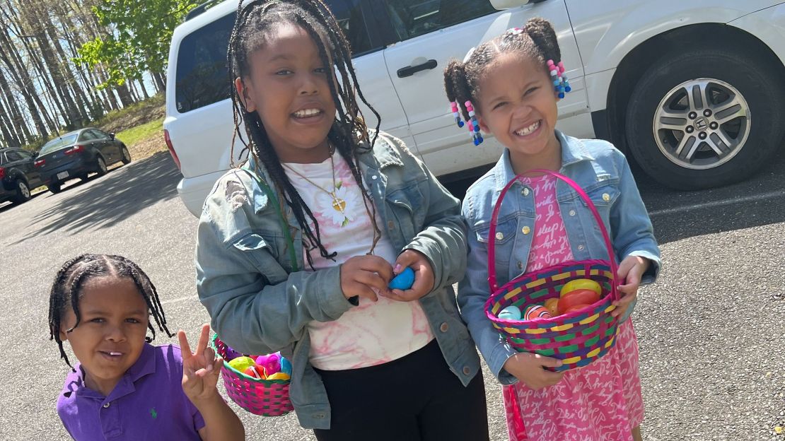 Kingston Campbell poses with his very protective big sisters.