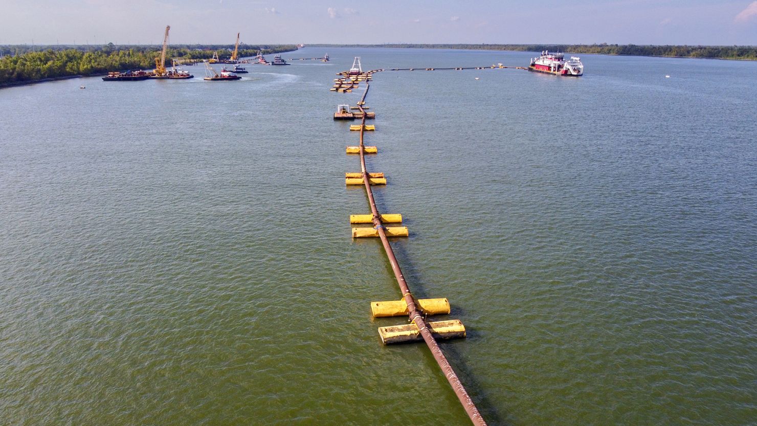 US Army Corps of Engineers crews use dredges and pipes to move silt onto an underwater sill along the bottom of the Mississippi River September 22, about 20 miles downriver from New Orleans.