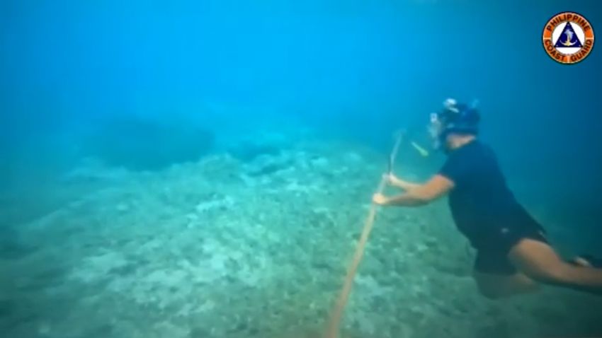 Philippine Coast Guard removes Chinese floating barrier in disputed area of the South China Sea.