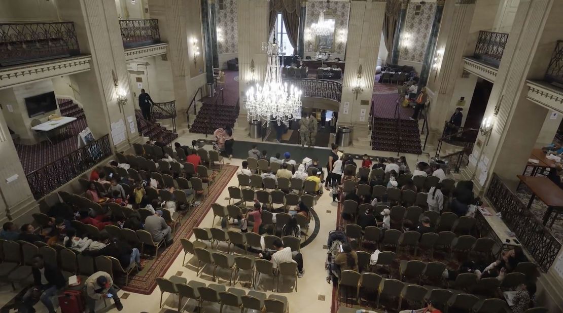 The grand lobby of the Roosevelt Hotel is now a waiting room for asylum seekers looking for help in New York City.