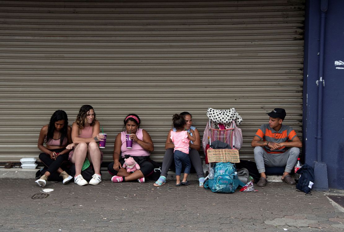 A group of Venezuelan migrants ask for money to continue their journey to the United States in San Jose, Costa Rica, on October 13, 2022.