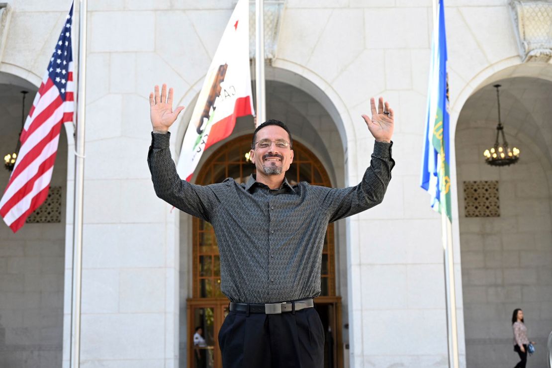 Gerardo Cabanillas waves from outside the Hall of Justice in downtown Los Angeles after his exoneration.