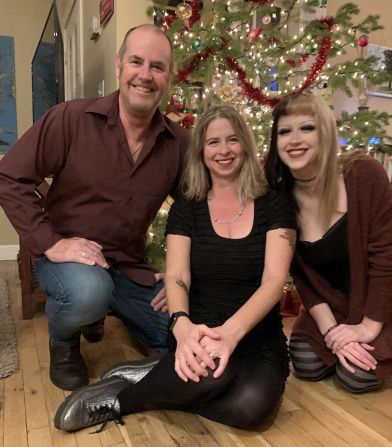 <strong>Family photo:</strong> Tim and Tracy live in Boulder, Colorado with their 17-year-old daughter. Here's the family pictured together last Christmas. "We joke with her, 'If it wasn't for that hotel note that Tim happened to see, you wouldn't be here,'" says Tracy.