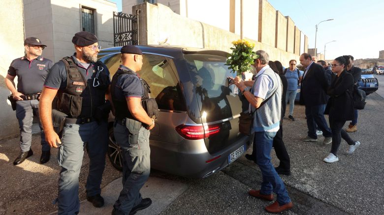 The hearse carrying late mafia boss Matteo Messina Denaro arrives at the cemetery in the Sicilian town of Castelvetrano, Italy, September 27, 2023. Also present are: Denaro's brother, Salvatore and his two sisters, Beatrice and Giovanna. REUTERS/Igor Petyx NO RESALES. NO ARCHIVES