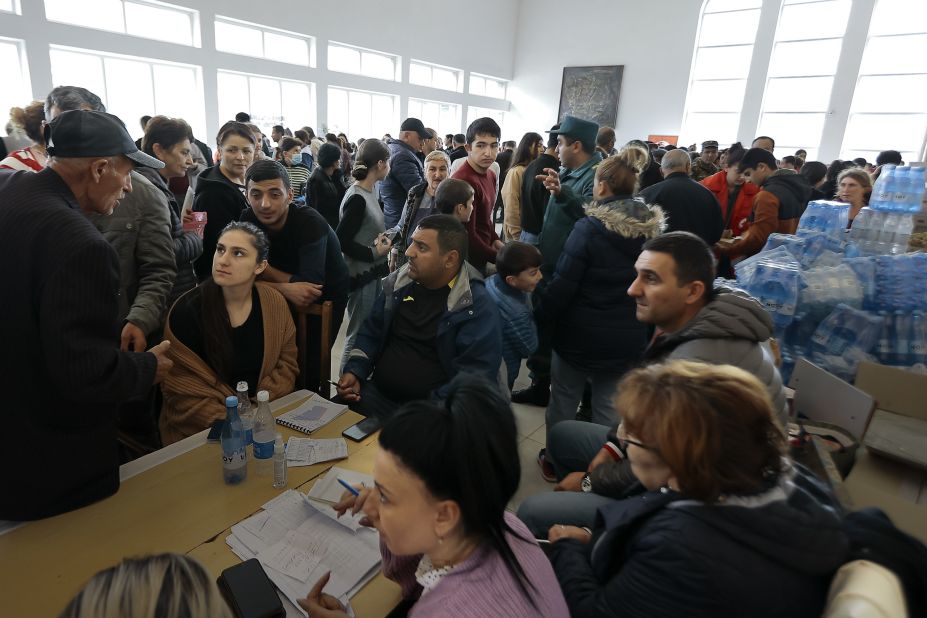 Ethnic Armenians from Nagorno-Karabakh line up to receive humanitarian aid at a temporary camp in Goris on September 26.