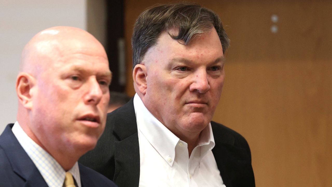 Rex Heuermann appears with his lawyer Michael J. Brown, left, at Suffolk County Court in Riverhead, N.Y., on Wednesday, Sept. 27, 2023. Heuermann was charged last month in the deaths of three women and is the prime suspect in a fourth.