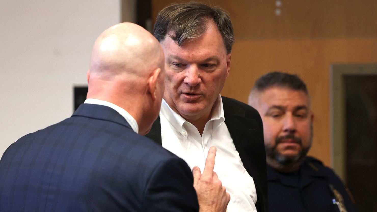 Rex Heuermann appears with his lawyer Michael Brown, left, at Suffolk County Court in Riverhead, New York, on Wednesday.
