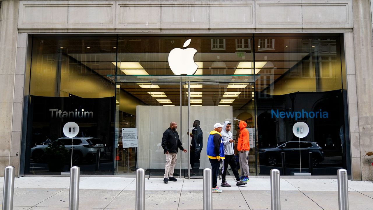 People outside an Apple store on Wednesday after the business was ransacked the previous evening.