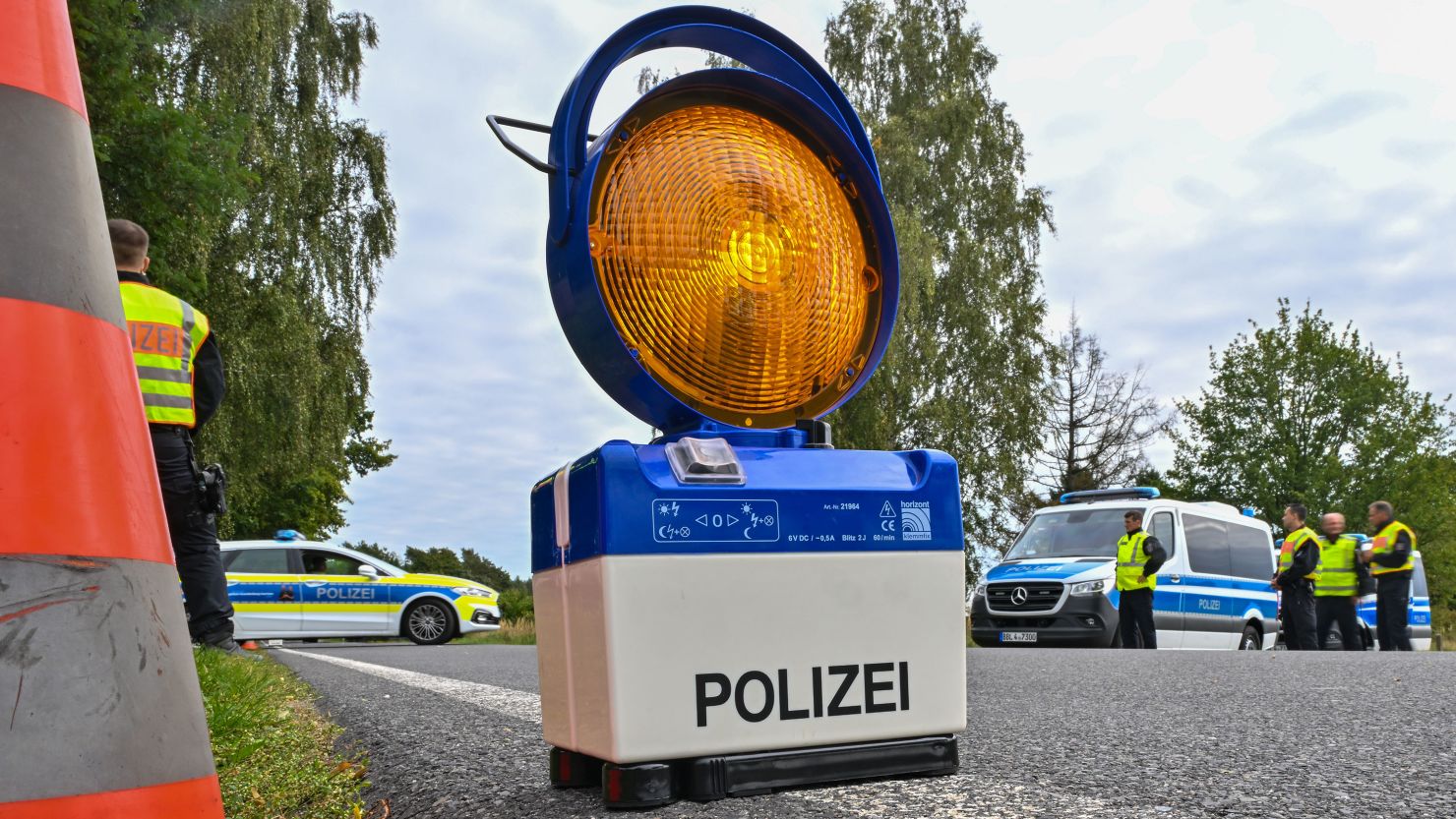A warning signal stands on the road during a police check against the smuggling of migrants in Germany, September 25, 2023.