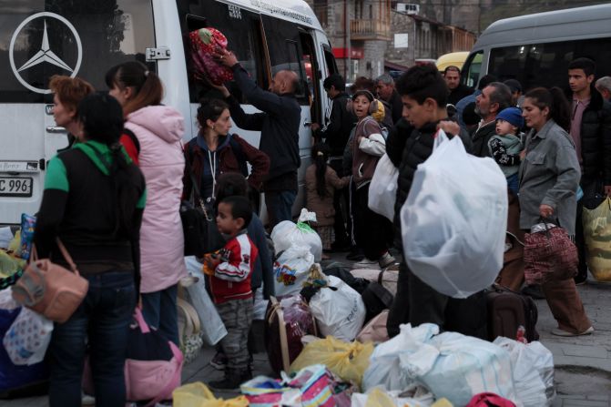 People from Nagorno-Karabakh board a bus near a Red Cross registration center in Goris, Armenia, on September 27.