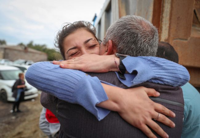 Karine Djagaryan, who fled Nagorno-Karabakh, hugs her father, Novlet, as they meet in Kornidzor on September 26.