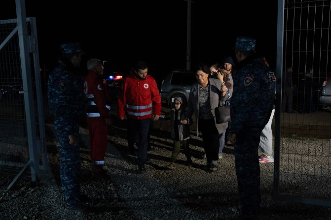 A family arrives at the Red Cross humanitarian hub set up in Kornidzor on September 25.