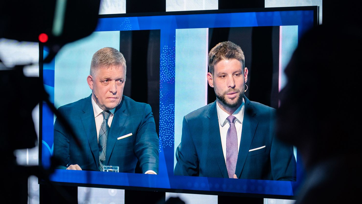 Robert Fico, leader of the SMER party (left) and Progressive Slovakia party leader Michal Šimečka are seen on a TV screen during a televised debate last week.
