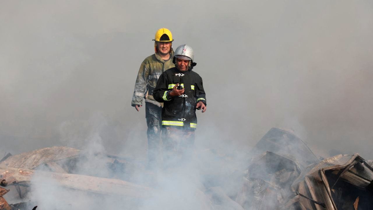 Emergency responders work at the scene following an explosion at a warehouse in Tashkent, Uzbekistan, on Thursday. 