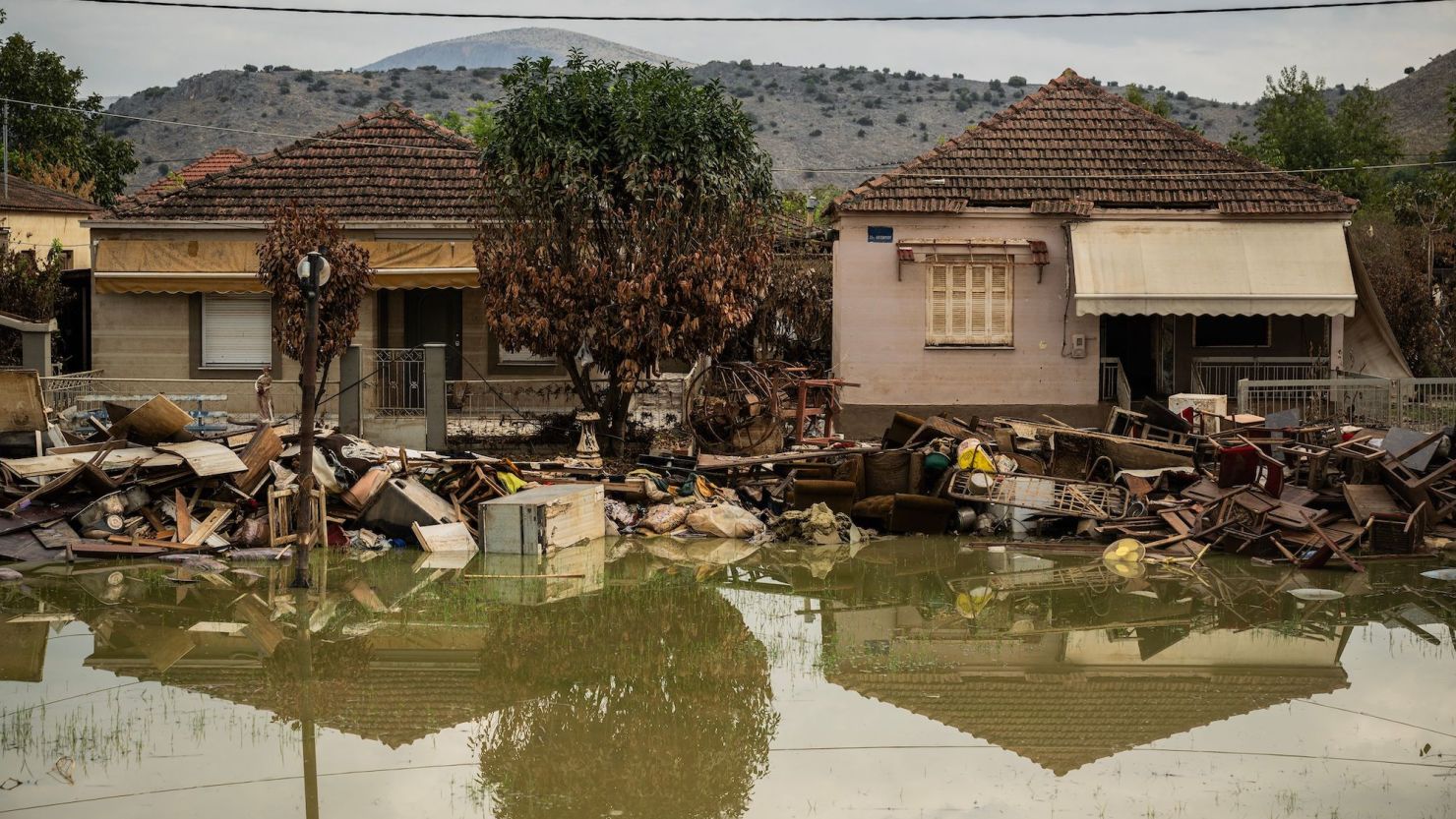 Damaged houses and debris in the village of Keramidi, central Greece, on September 26.