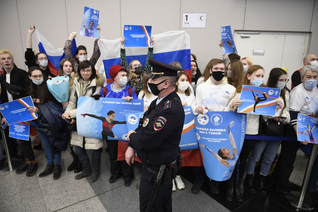 Supporters of Russia's figure skater Kamila Valieva hold posters as they wait for her arrival from China at the Sheremetevo airport outside Moscow on February 18, 2022. - The sport has been under intense scrutiny at the Beijing Olympics after 15-year-old Russian prodigy Kamila Valieva was allowed to compete despite failing a drugs test before the Games, with her youth cited as a factor in the decision. (Photo by Alexander NEMENOV / AFP) (Photo by ALEXANDER NEMENOV/AFP via Getty Images)