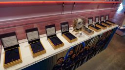 Nine empty boxes, which belong to members of the U.S. figure skating team who finished in second place last year in the Winter Olympics in Beijing, sit in a display case in the U.S. Olympic and Paralympic Museum on Thursday, June 22, 2023, in Colorado Springs, Colo. The figure skaters have not received their medals while a doping case involving a Russian skater plays out. (AP Photo/David Zalubowski)