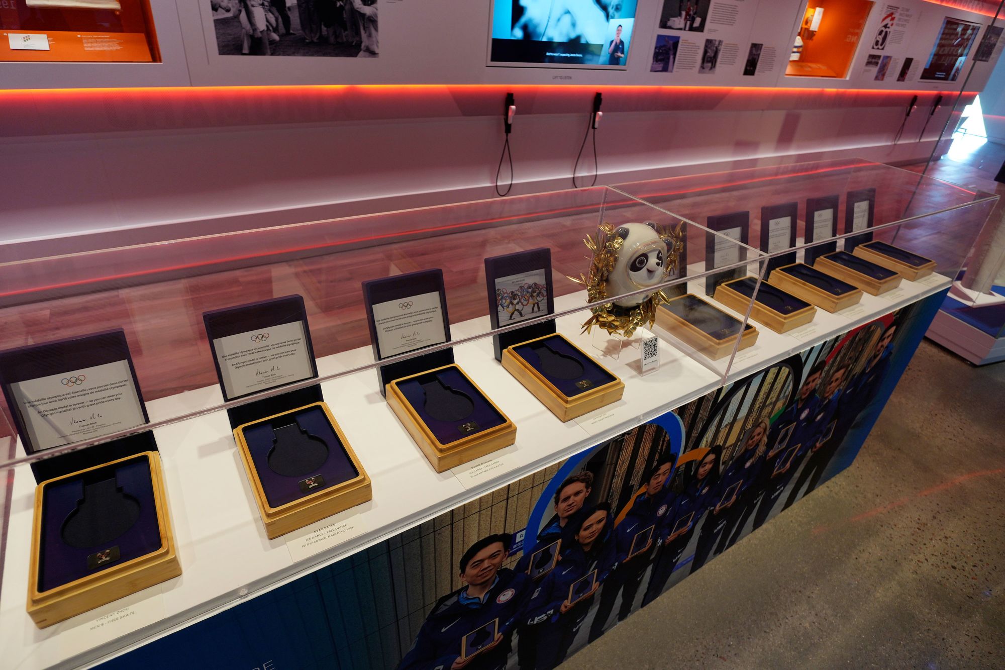 Nine empty boxes, which belong to members of the U.S. figure skating team who finished in second place last year in the Winter Olympics in Beijing, sit in a display case in the U.S. Olympic and Paralympic Museum on Thursday, June 22, 2023, in Colorado Springs, Colo. The figure skaters have not received their medals while a doping case involving a Russian skater plays out. (AP Photo/David Zalubowski)