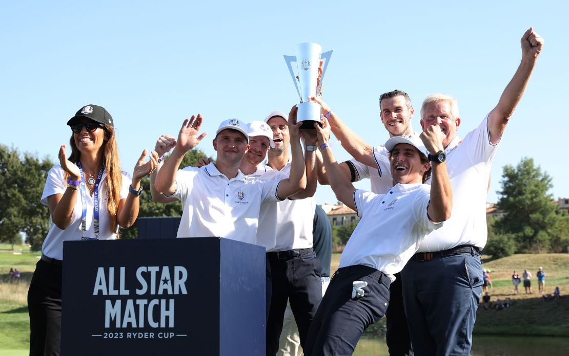 ROME, ITALY - SEPTEMBER 27: Kipp Poppert, Garrett Hilbert, Novak Djokovic, Gareth Bale, Leonardo Fioravanti, and Colin Montgomerie celebrate with the trophy following victory during the All-Star Match at the 2023 Ryder Cup at Marco Simone Golf Club on September 27, 2023 in Rome, Italy. (Photo by Jamie Squire/Getty Images)