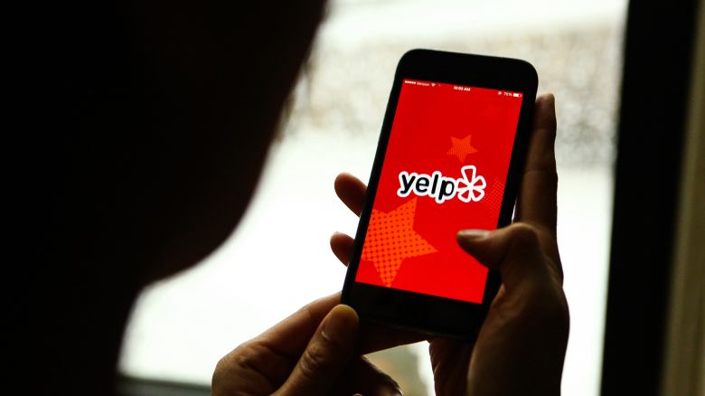 The Yelp application is displayed on an iPhone in February 2016.