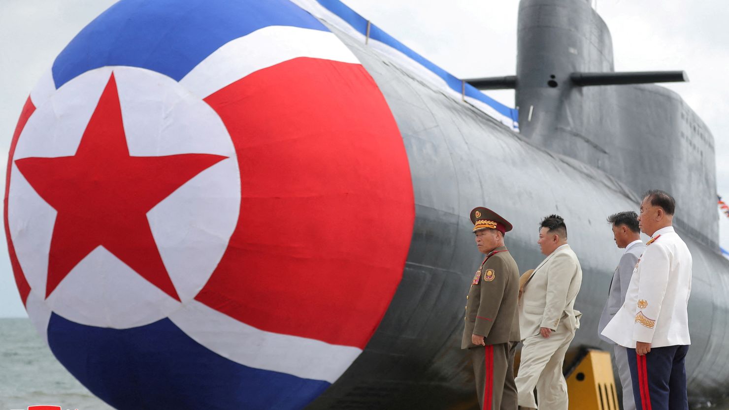 North Korean leader Kim Jong Un attends a launching ceremony for a new tactical nuclear attack submarine, according to state media, on September 8, 2023. 