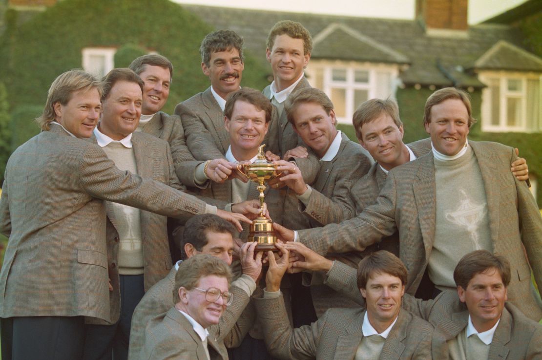 Tom Watson (centre holding trophy) captain of the United States team with team members Fred Couples,Chip Beck,Lee Janzen, Corey Pavin, John Cook, Payne Stewart, Davis Love III, Jim Gallagher, Jr., Raymond Floyd, Tom Kite, Paul Azinger and Lanny Wadkins after defeating Europe 13 to 15 at the 30th Ryder Cup Matches on 26 September 1993 at The Belfry in Wishaw, Warwickshire, England. (Photo by photographer name Chris Cole/Getty Images)