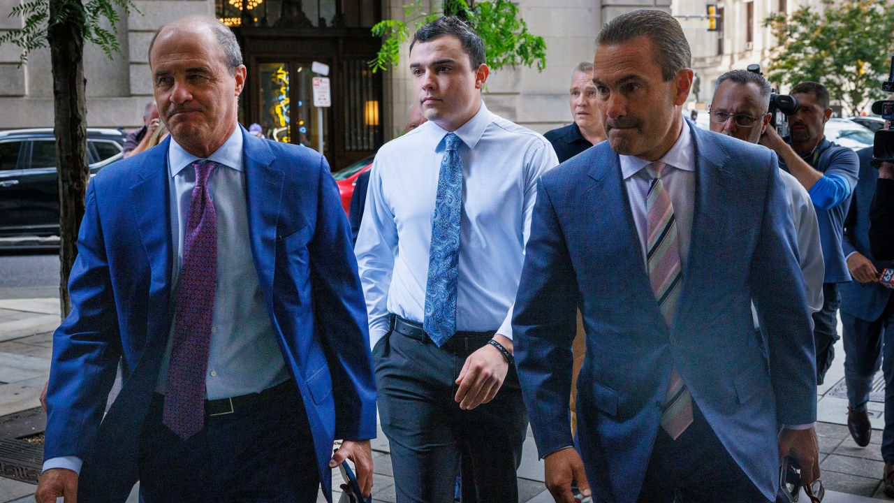 Philadelphia police Officer Mark Dial, center, arrives at court in Philadelphia, on September 19, 2023, for a bail hearing.