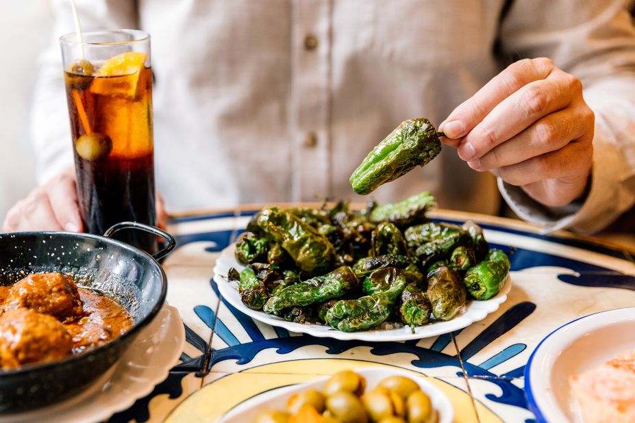 <strong>Pimientos de Padrón:</strong> A perfect complement to a cool beverage, these salted Padrón peppers are addictively sweet, salty and sometimes fiery hot. 
