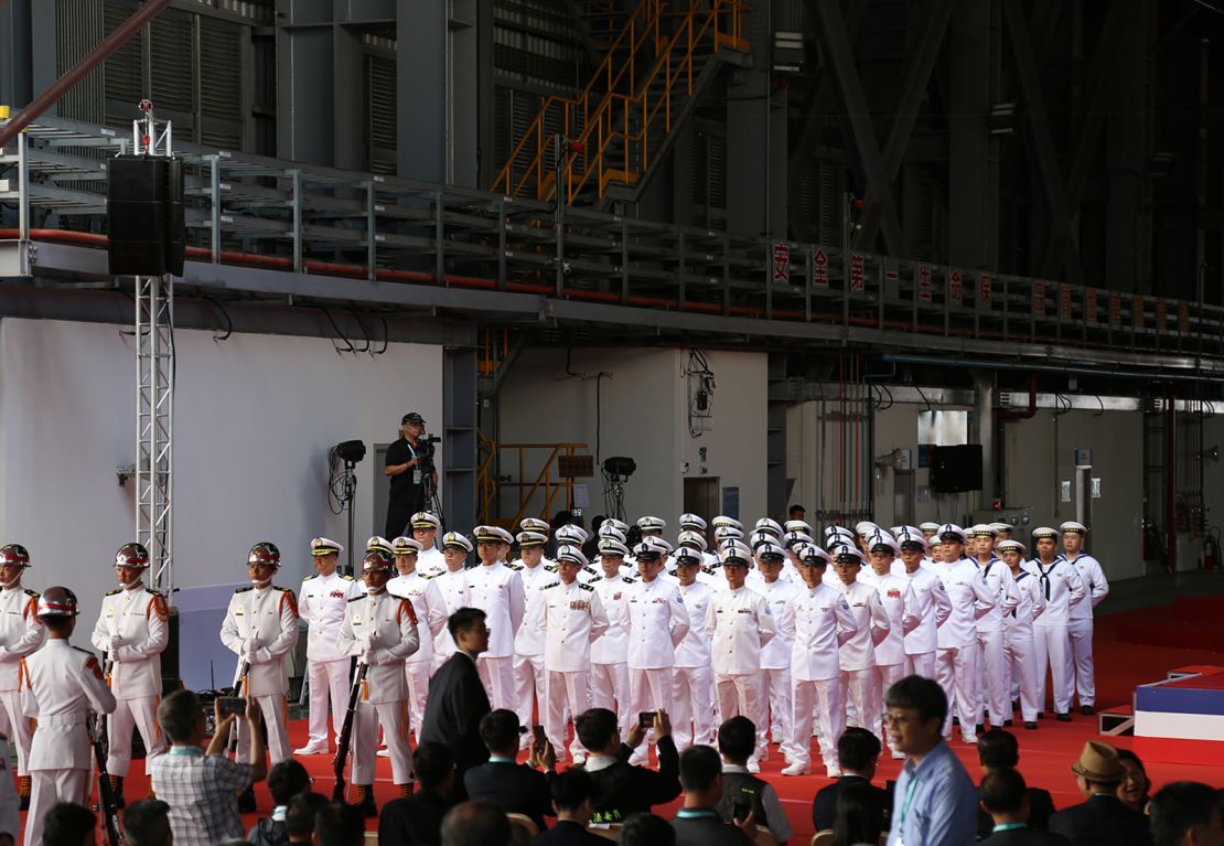 Dozens of naval officers at the submarine's shipyard welcome President Tsai Ing-wen to the launch ceremony in Kaohsiung on September 28.