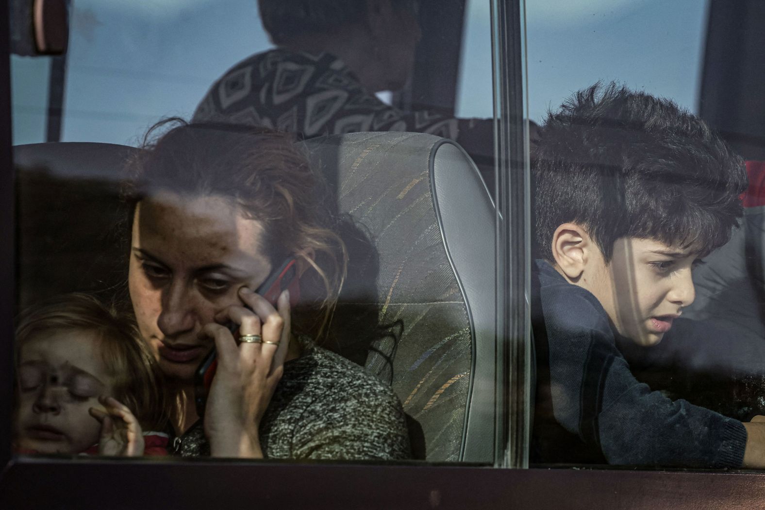 People who fled Nagorno-Karabakh sit on a bus after registering at the Armenian Ministry of Foreign Affairs near the border town of Kornidzor on September 24.