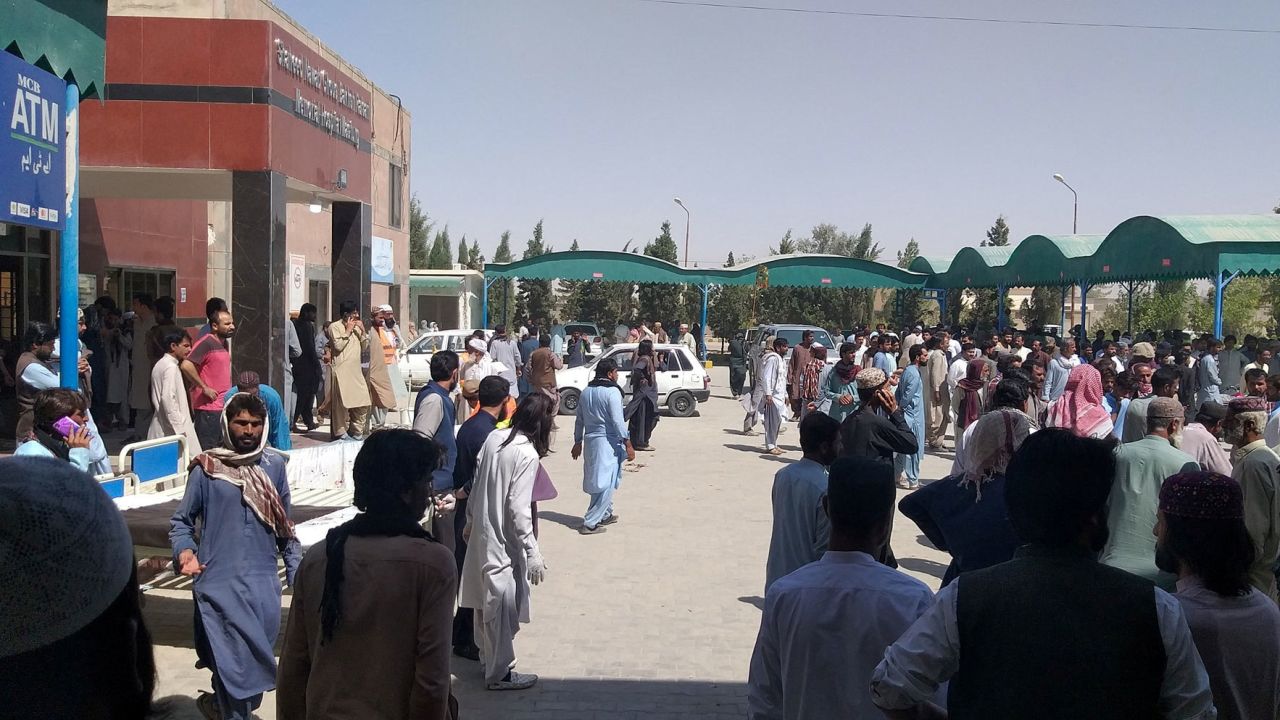 People gather outside the Mastung hospital, following the deadly attack, on September 29, 2023.